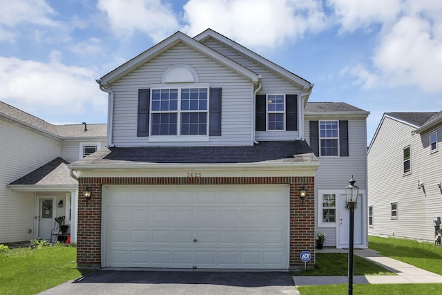 3625 Parker Knoll Ln, Columbus, OH 43219 - traditional-style house with brick siding, driveway, an attached garage, and roof with shingles