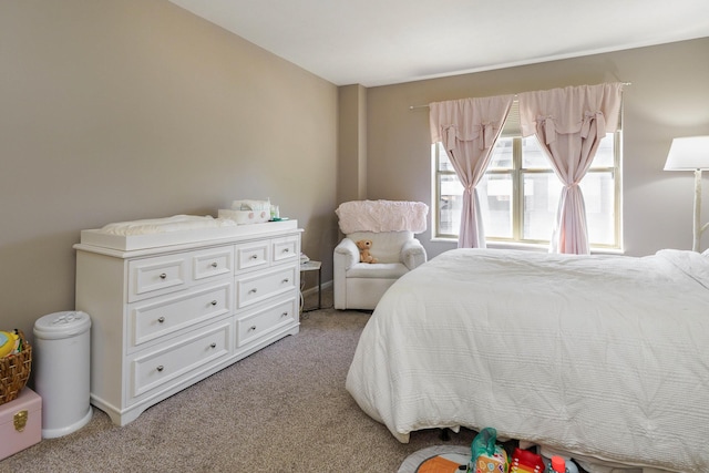 bedroom featuring light colored carpet