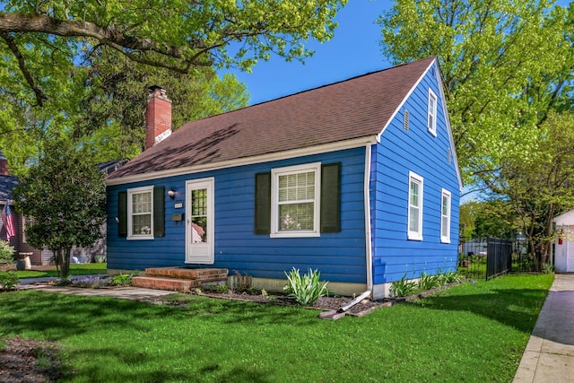 263 E Beaumont Rd, Columbus, OH 43214 - view of front of property with a chimney, roof with shingles, and a garage