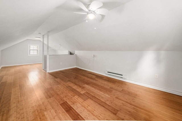 263 E Beaumont Rd, Columbus, OH 43214 - bonus room featuring a baseboard heating unit, wood finished floors, lofted ceiling, ceiling fan, and baseboards