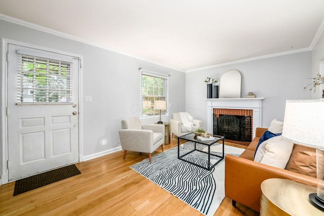 263 E Beaumont Rd, Columbus, OH 43214 - living area featuring light wood-type flooring, crown molding, a brick fireplace, and baseboards