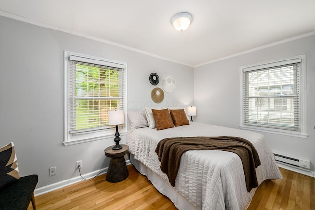 263 E Beaumont Rd, Columbus, OH 43214 - bedroom with a baseboard heating unit, ornamental molding, wood finished floors, and baseboards
