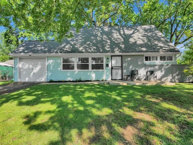 4838 Calvin Dr, Columbus, OH 43227 - cape cod house with a front yard, an attached garage, and roof with shingles