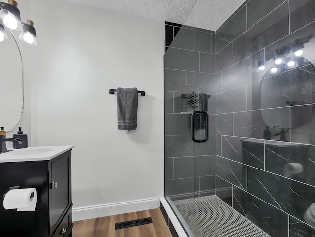 4838 Calvin Dr, Columbus, OH 43227 - full bathroom featuring a stall shower, wood finished floors, vanity, and baseboards