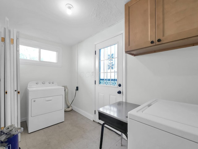 4838 Calvin Dr, Columbus, OH 43227 - laundry area with cabinet space, baseboards, and washer and dryer