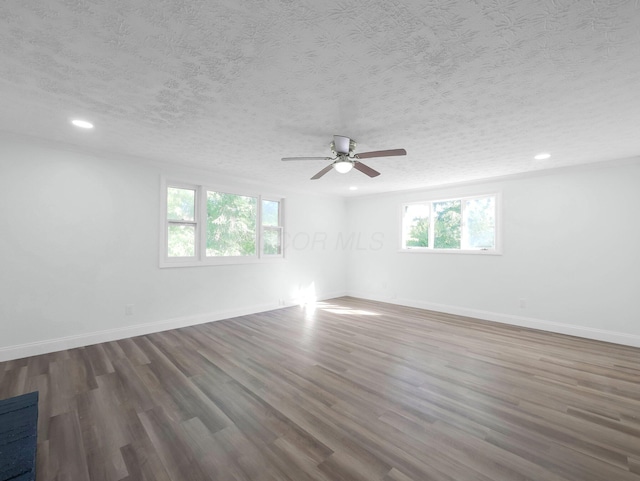 4838 Calvin Dr, Columbus, OH 43227 - spare room with a textured ceiling, wood finished floors, baseboards, ceiling fan, and recessed lighting