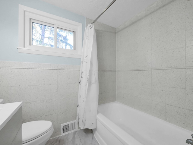 4838 Calvin Dr, Columbus, OH 43227 - full bathroom featuring toilet, vanity, and shower / tub combo