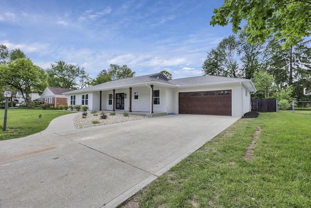 2727 Westmont Blvd, Columbus, OH 43221 - ranch-style house with an attached garage, concrete driveway, a porch, and stucco siding