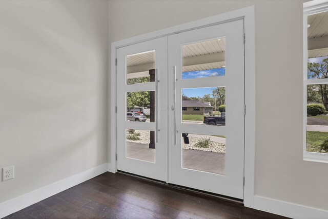 2727 Westmont Blvd, Columbus, OH 43221 - doorway to outside featuring french doors, healthy amount of natural light, dark wood finished floors, and baseboards