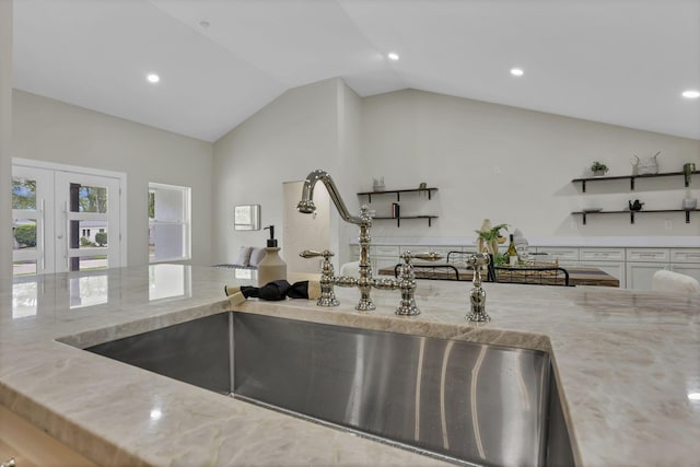 2727 Westmont Blvd, Columbus, OH 43221 - kitchen view of a sink, light stone countertops, recessed lighting, and french doors
