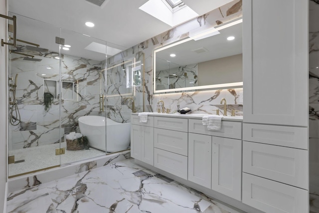 2727 Westmont Blvd, Columbus, OH 43221 - bathroom with a skylight, a marble finish shower, double vanity, a freestanding bath, and recessed lighting