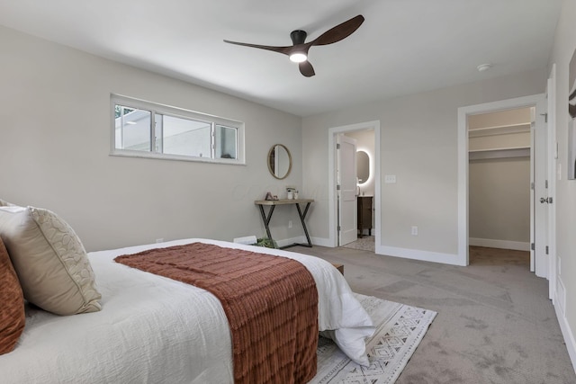 2727 Westmont Blvd, Columbus, OH 43221 - bedroom featuring a spacious closet, light colored carpet, baseboards, ceiling fan, and ensuite bath
