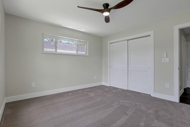 2727 Westmont Blvd, Columbus, OH 43221 - unfurnished bedroom featuring dark carpet, a closet, baseboards, and ceiling fan
