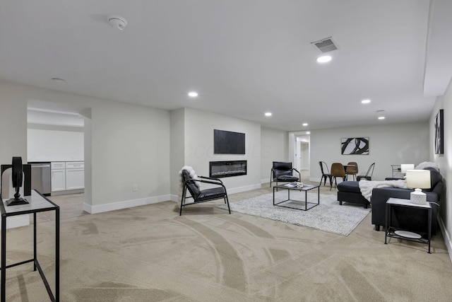 2727 Westmont Blvd, Columbus, OH 43221 - living room featuring light carpet, recessed lighting, a glass covered fireplace, and baseboards