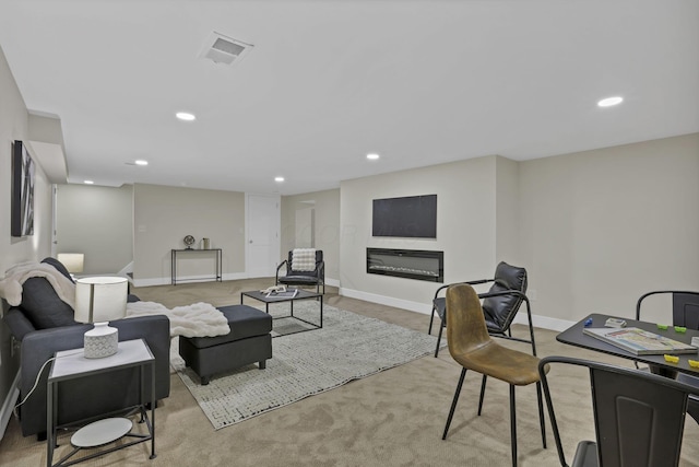 2727 Westmont Blvd, Columbus, OH 43221 - living room with recessed lighting, baseboards, light colored carpet, and a glass covered fireplace