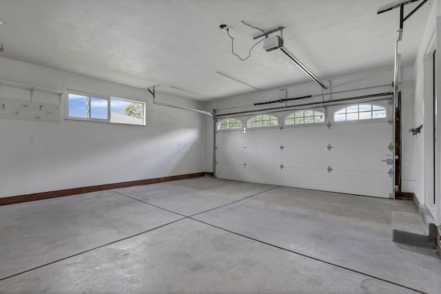 2727 Westmont Blvd, Columbus, OH 43221 - garage with a garage door opener and baseboards