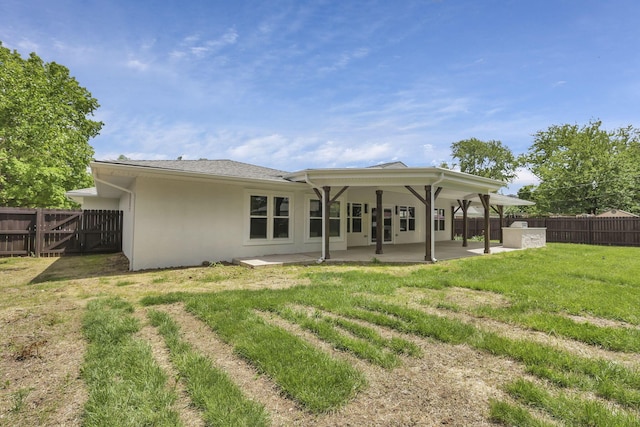 2727 Westmont Blvd, Columbus, OH 43221 - back of property with stucco siding, a patio, and a gate