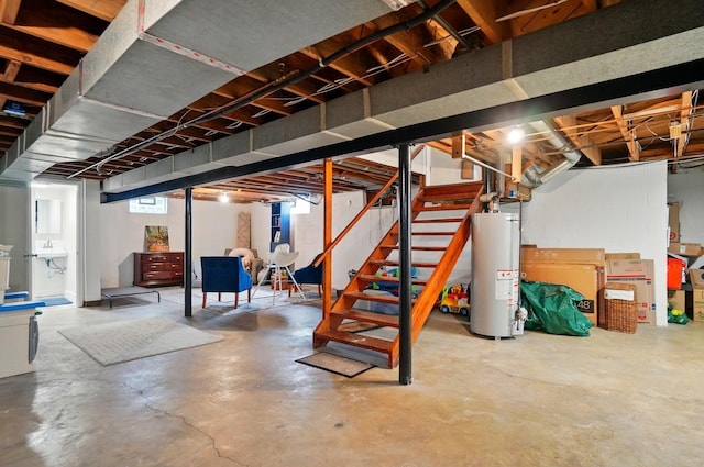 unfinished below grade area featuring gas water heater and stairway