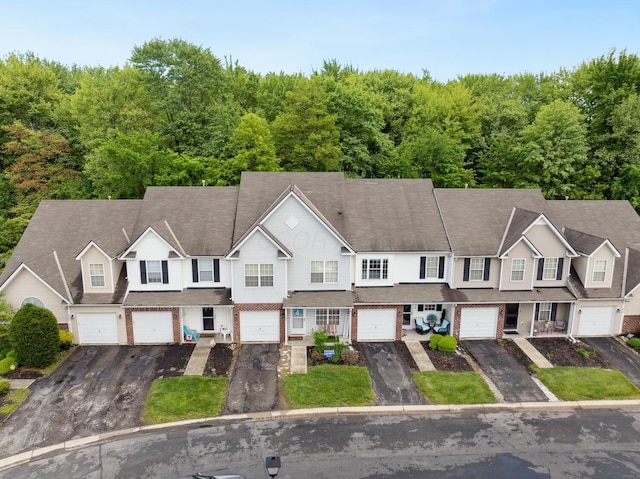view of front of property featuring driveway and a garage