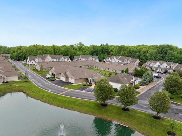 aerial perspective of suburban area featuring a nearby body of water