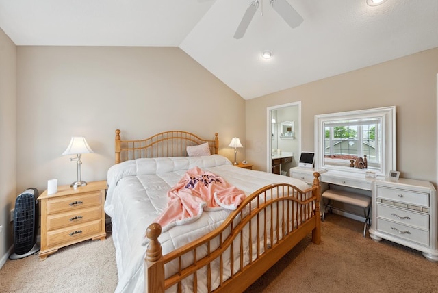 bedroom featuring carpet floors, vaulted ceiling, connected bathroom, and ceiling fan