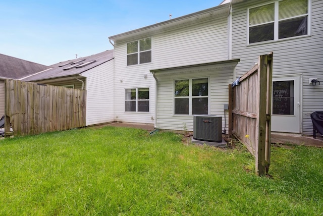 back of property featuring central AC unit