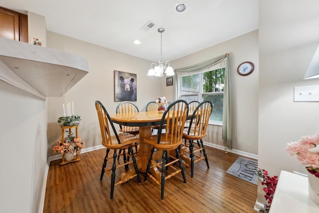 dining room with wood finished floors, baseboards, a chandelier, and recessed lighting