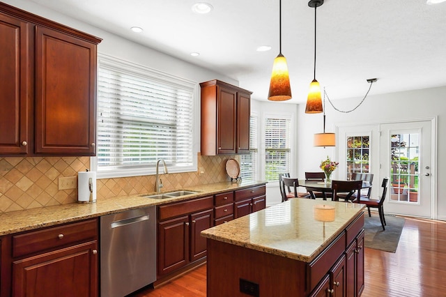 6415 Green Stone Loop, Dublin, OH 43016 - kitchen featuring a sink, dishwasher, wood finished floors, hanging light fixtures, and healthy amount of natural light