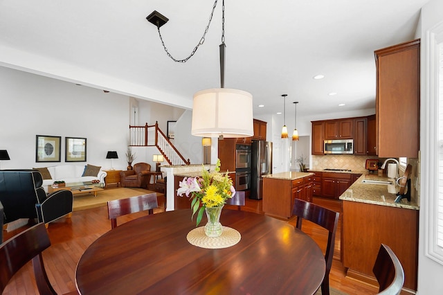 6415 Green Stone Loop, Dublin, OH 43016 - dining space with stairs, dark wood-style flooring, and recessed lighting