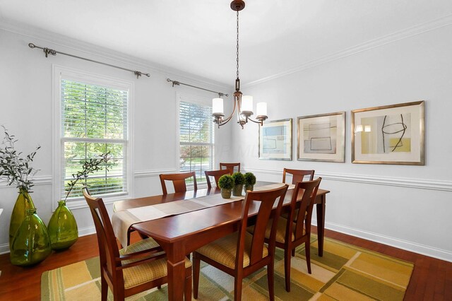 6415 Green Stone Loop, Dublin, OH 43016 - dining space with wood finished floors, a chandelier, crown molding, and baseboards