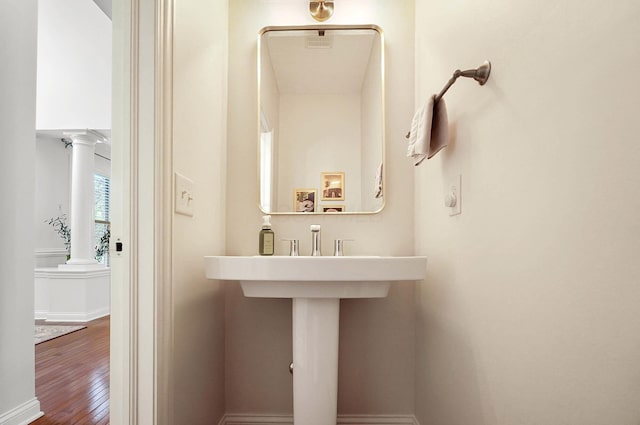 6415 Green Stone Loop, Dublin, OH 43016 - bathroom with ornate columns, wood finished floors, and baseboards