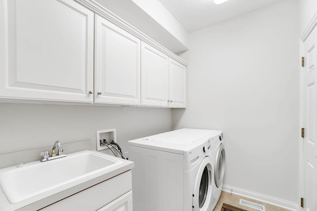 6415 Green Stone Loop, Dublin, OH 43016 - laundry room with cabinet space, washer and clothes dryer, and baseboards
