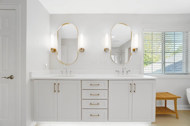 6415 Green Stone Loop, Dublin, OH 43016 - full bathroom with double vanity, baseboards, and a shower