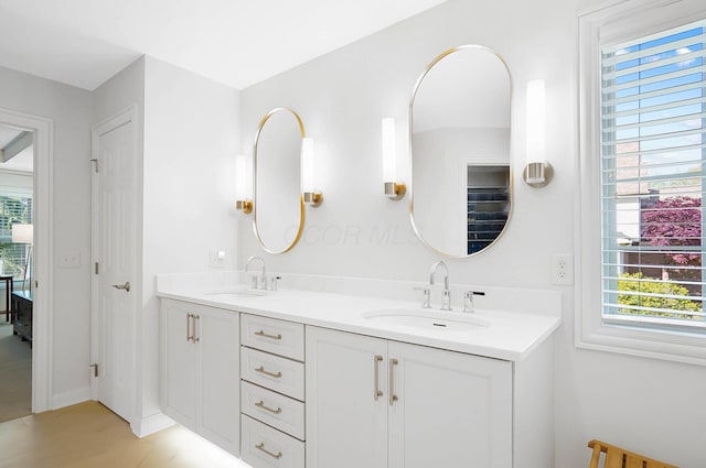 6415 Green Stone Loop, Dublin, OH 43016 - bathroom with double vanity, wood finished floors, and baseboards
