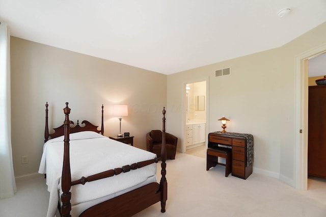 6415 Green Stone Loop, Dublin, OH 43016 - bedroom with light colored carpet, connected bathroom, and baseboards
