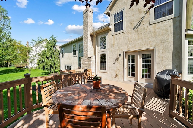 6415 Green Stone Loop, Dublin, OH 43016 - wooden deck with outdoor dining area, grilling area, and a yard