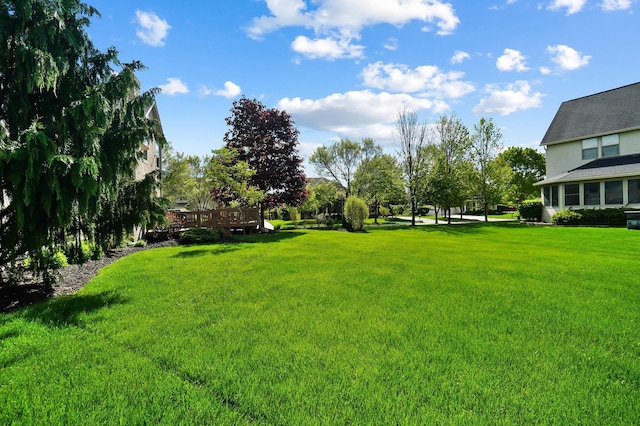 6415 Green Stone Loop, Dublin, OH 43016 - view of green lawn with a wooden deck