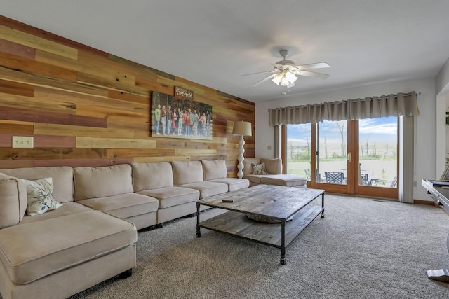 1719 Marion Rd NW, Utica, OH 43080 - carpeted living area featuring wood walls and ceiling fan