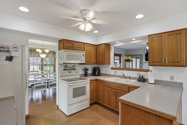 1719 Marion Rd NW, Utica, OH 43080 - kitchen featuring white appliances, a sink, a ceiling fan, brown cabinetry, and recessed lighting