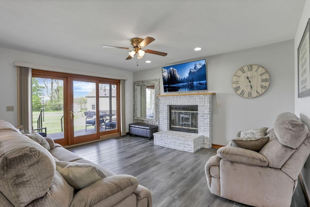 1719 Marion Rd NW, Utica, OH 43080 - living room featuring a ceiling fan, recessed lighting, a brick fireplace, and wood finished floors
