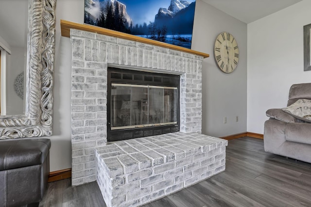 1719 Marion Rd NW, Utica, OH 43080 - living room featuring baseboards, wood finished floors, and a fireplace