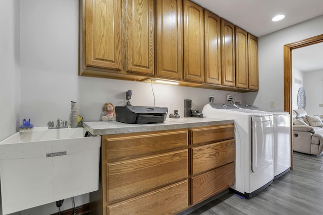1719 Marion Rd NW, Utica, OH 43080 - clothes washing area featuring cabinet space, light wood-style flooring, washer and clothes dryer, and recessed lighting