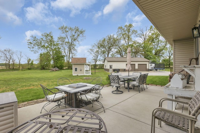 1719 Marion Rd NW, Utica, OH 43080 - view of patio / terrace with outdoor dining space, a trampoline, and an outdoor structure