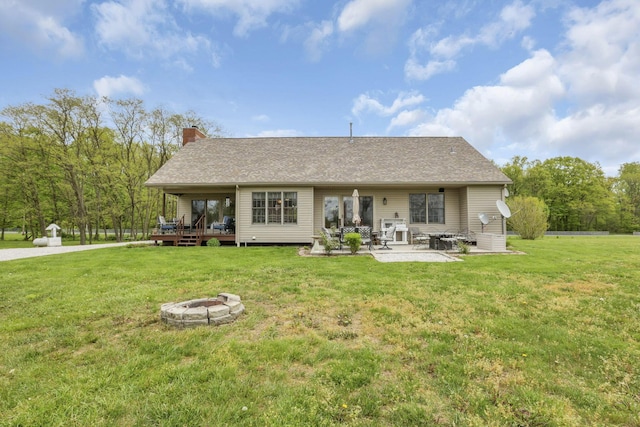 1719 Marion Rd NW, Utica, OH 43080 - back of property featuring an outdoor fire pit, a chimney, a yard, and a patio area