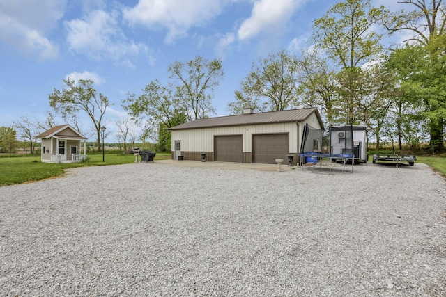 1719 Marion Rd NW, Utica, OH 43080 - view of outbuilding with a trampoline, an outbuilding, and driveway