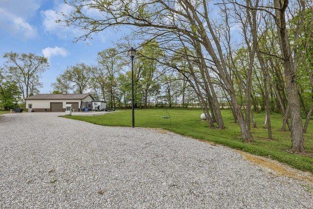 1719 Marion Rd NW, Utica, OH 43080 - view of green lawn featuring gravel driveway and an attached garage