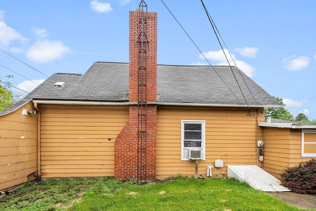 616 E Chestnut St, Mount Vernon, OH 43050 - rear view of property with a chimney, roof with shingles, and a lawn