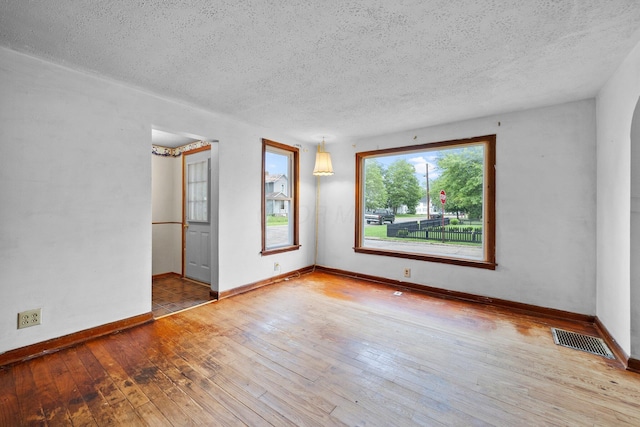 616 E Chestnut St, Mount Vernon, OH 43050 - unfurnished room with a textured ceiling, hardwood / wood-style flooring, and baseboards