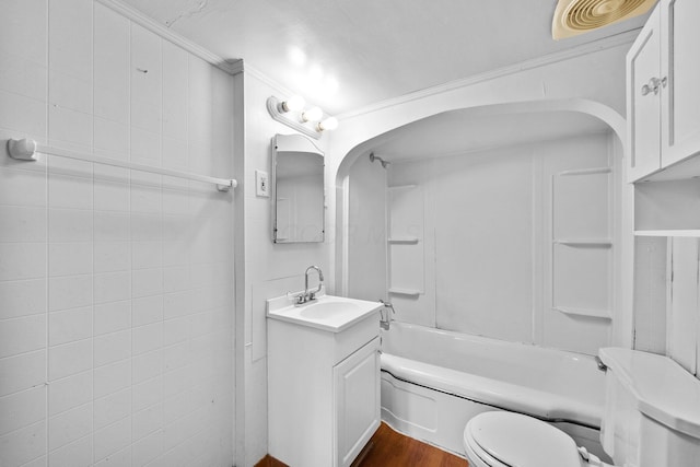 616 E Chestnut St, Mount Vernon, OH 43050 - bathroom with toilet, ornamental molding, vanity, wood finished floors, and shower / bath combination
