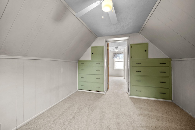 616 E Chestnut St, Mount Vernon, OH 43050 - additional living space featuring a ceiling fan, light colored carpet, vaulted ceiling, and wooden walls